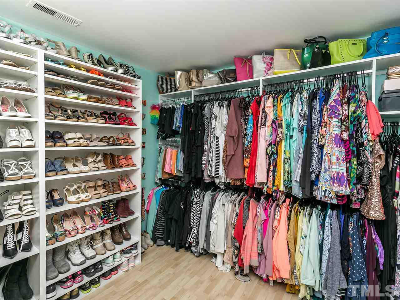 1722 Quail Ridge Road Raleigh, NC 27609 - Photo 17 of 28 a view of walk in closet with clothes and shoes