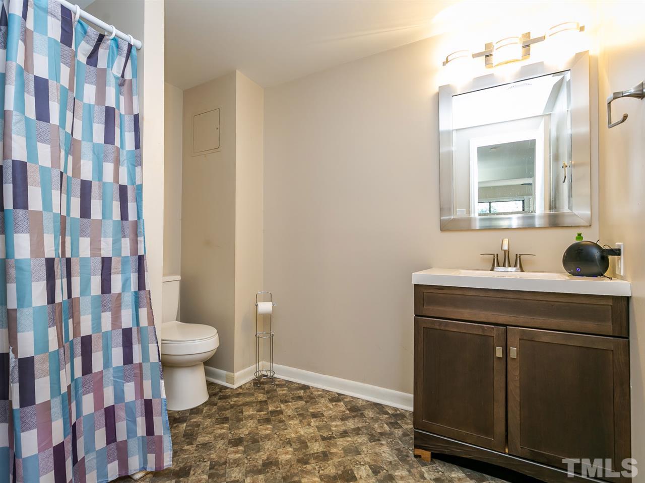 1722 Quail Ridge Road Raleigh, NC 27609 - Photo 21 of 28 a bathroom with a sink toilet and shower