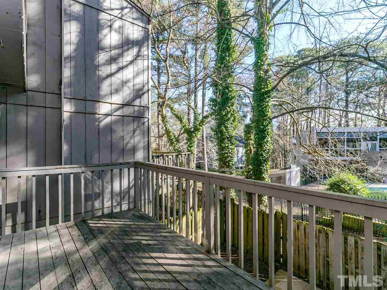 1722 Quail Ridge Road Raleigh, NC 27609 - Photo 24 of 28 a view of balcony with wooden floor and fence