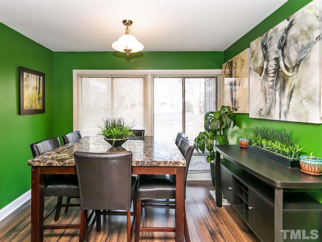 1722 Quail Ridge Road Raleigh, NC 27609 - Photo 6 of 28 a dining room with furniture potted plants and wooden floor