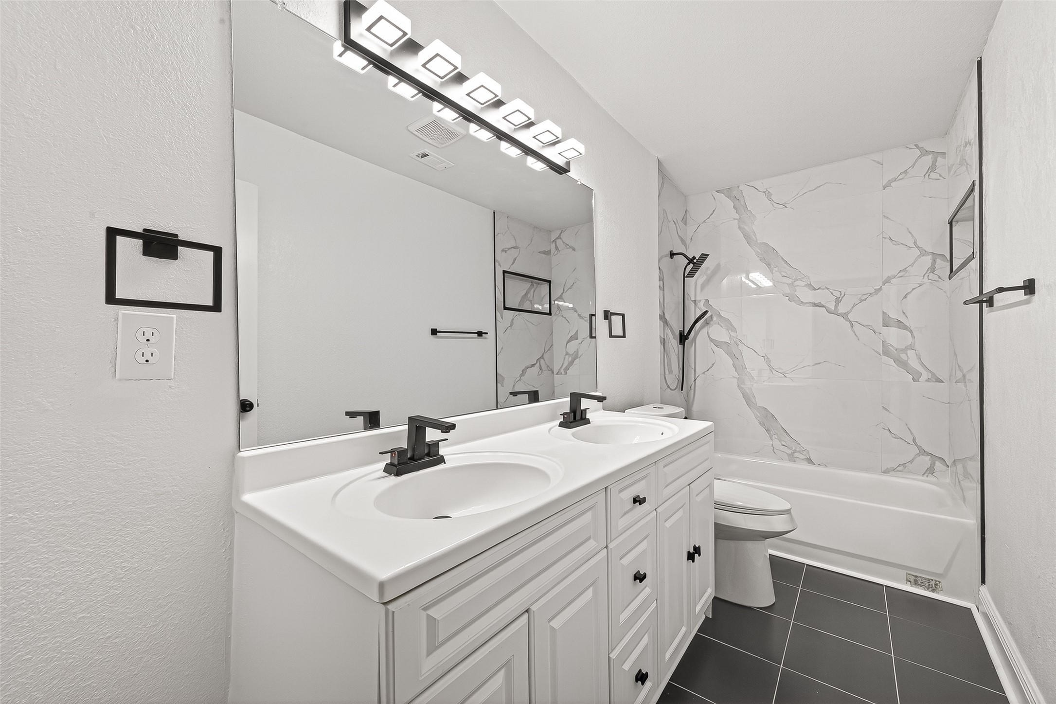 4729 Paradise Lane Houston, TX 77048 - Photo 20 of 43 a bathroom with a sink toilet vanity and shower