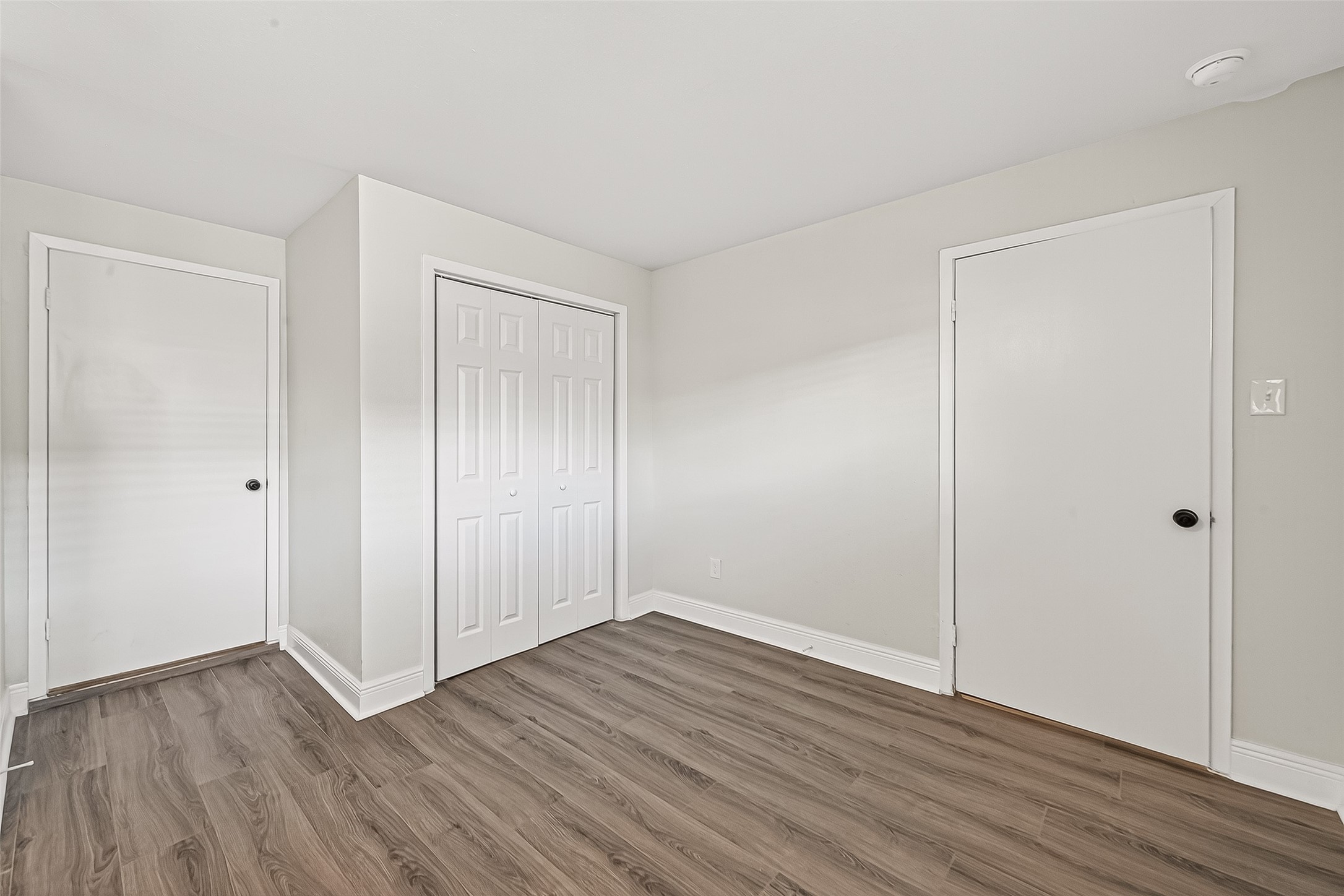 4729 Paradise Lane Houston, TX 77048 - Photo 21 of 43 a view of an empty room with wooden floor