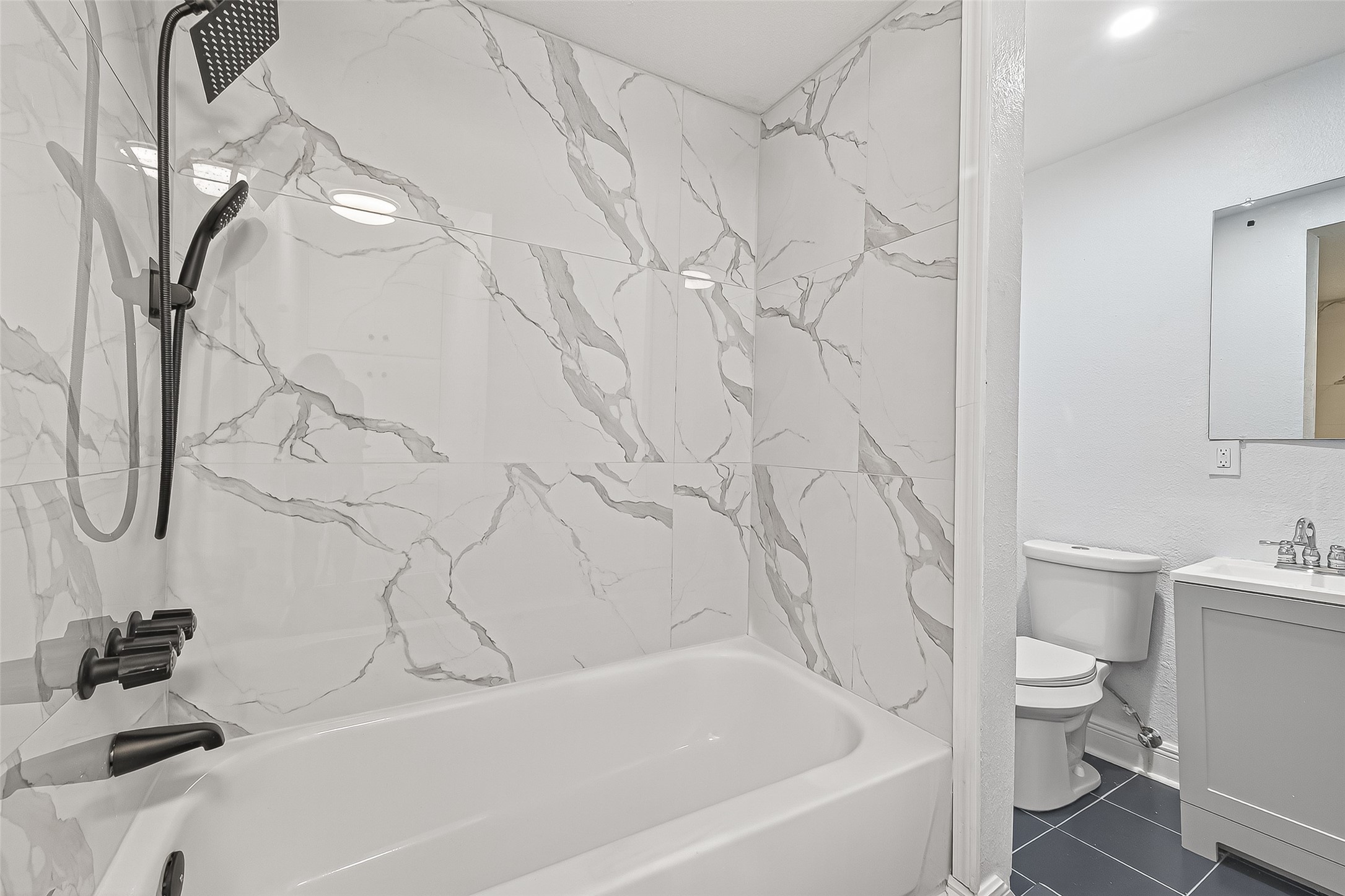 4729 Paradise Lane Houston, TX 77048 - Photo 29 of 43 a bathroom with a sink a toilet and a bathtub