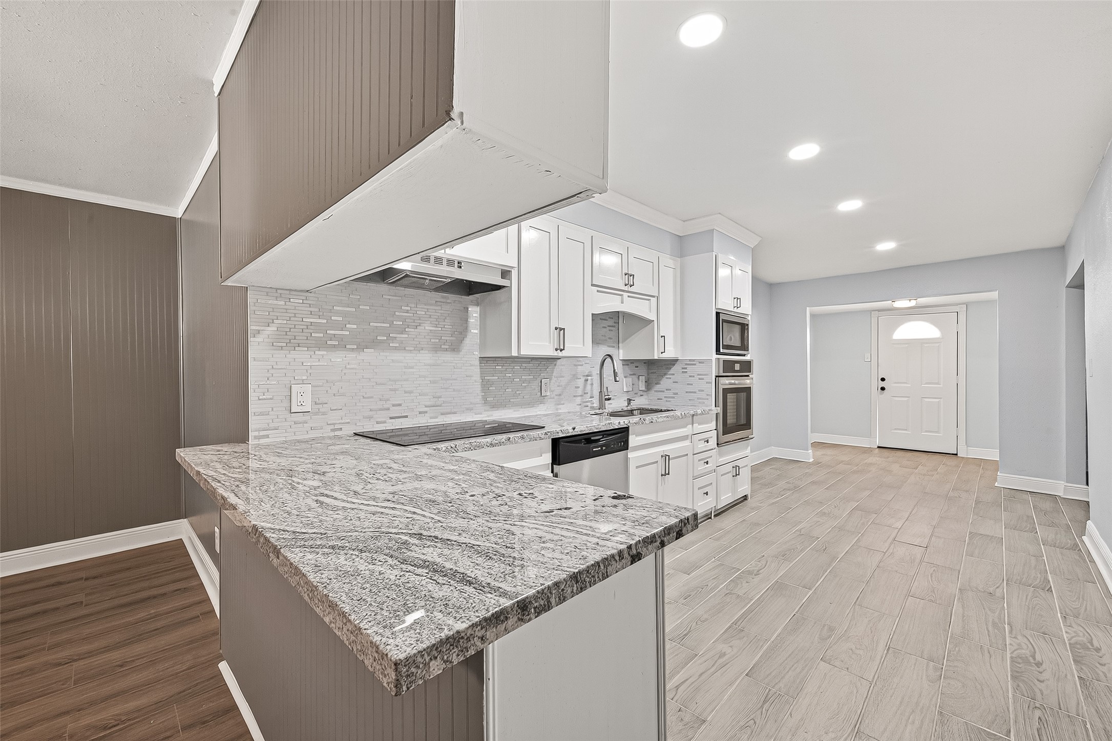 4729 Paradise Lane Houston, TX 77048 - Photo 31 of 43 a kitchen with stainless steel appliances granite countertop a sink stove and refrigerator