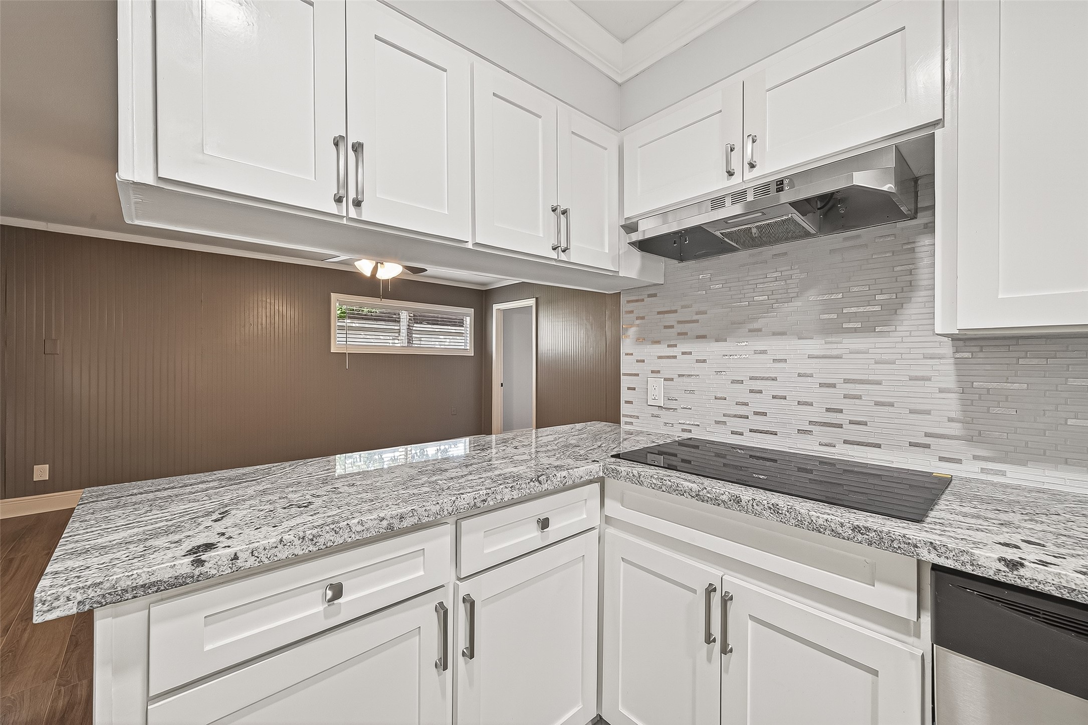 4729 Paradise Lane Houston, TX 77048 - Photo 32 of 43 a kitchen with granite countertop white cabinets and a sink