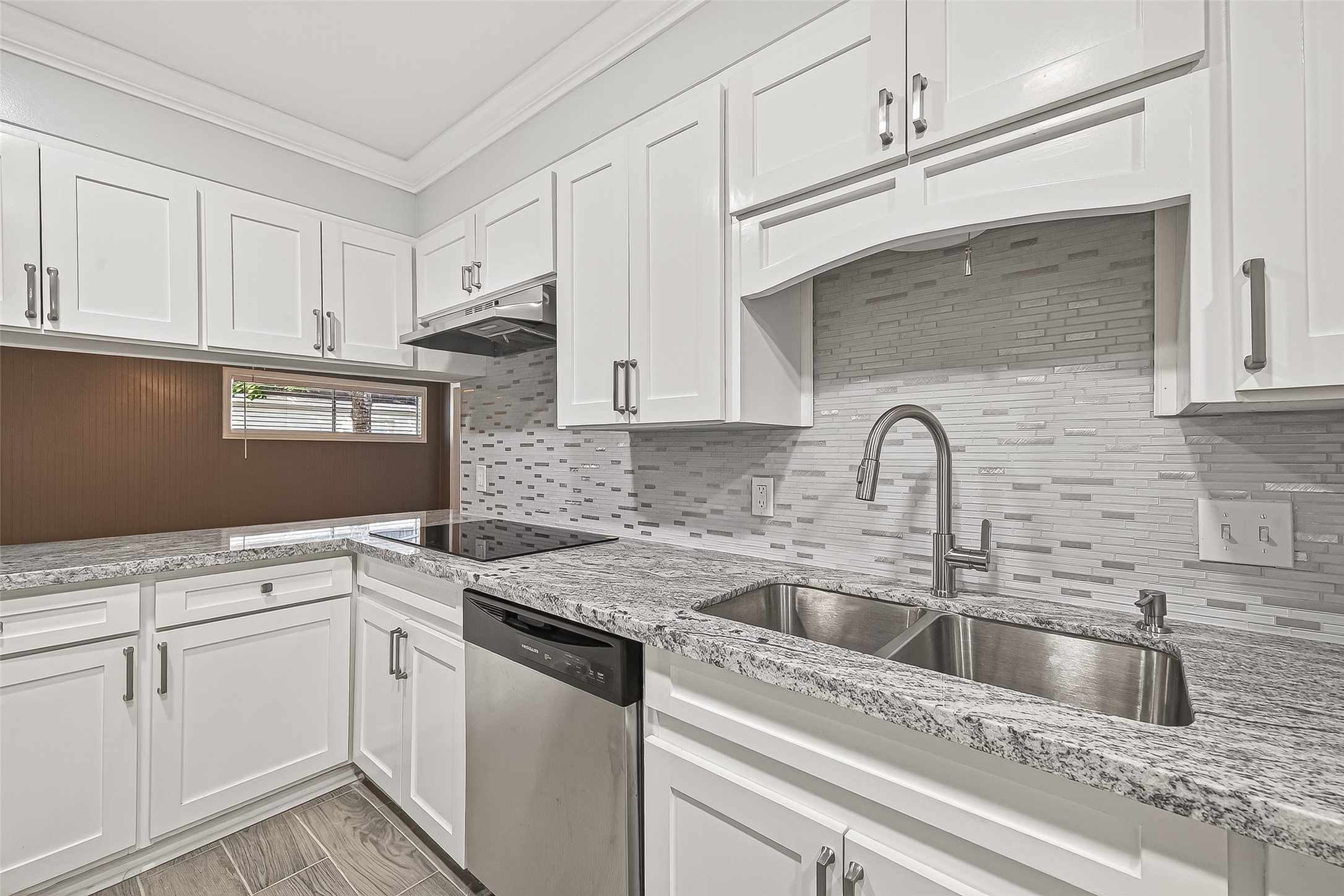 4729 Paradise Lane Houston, TX 77048 - Photo 34 of 43 a kitchen with granite countertop white cabinets and white appliances