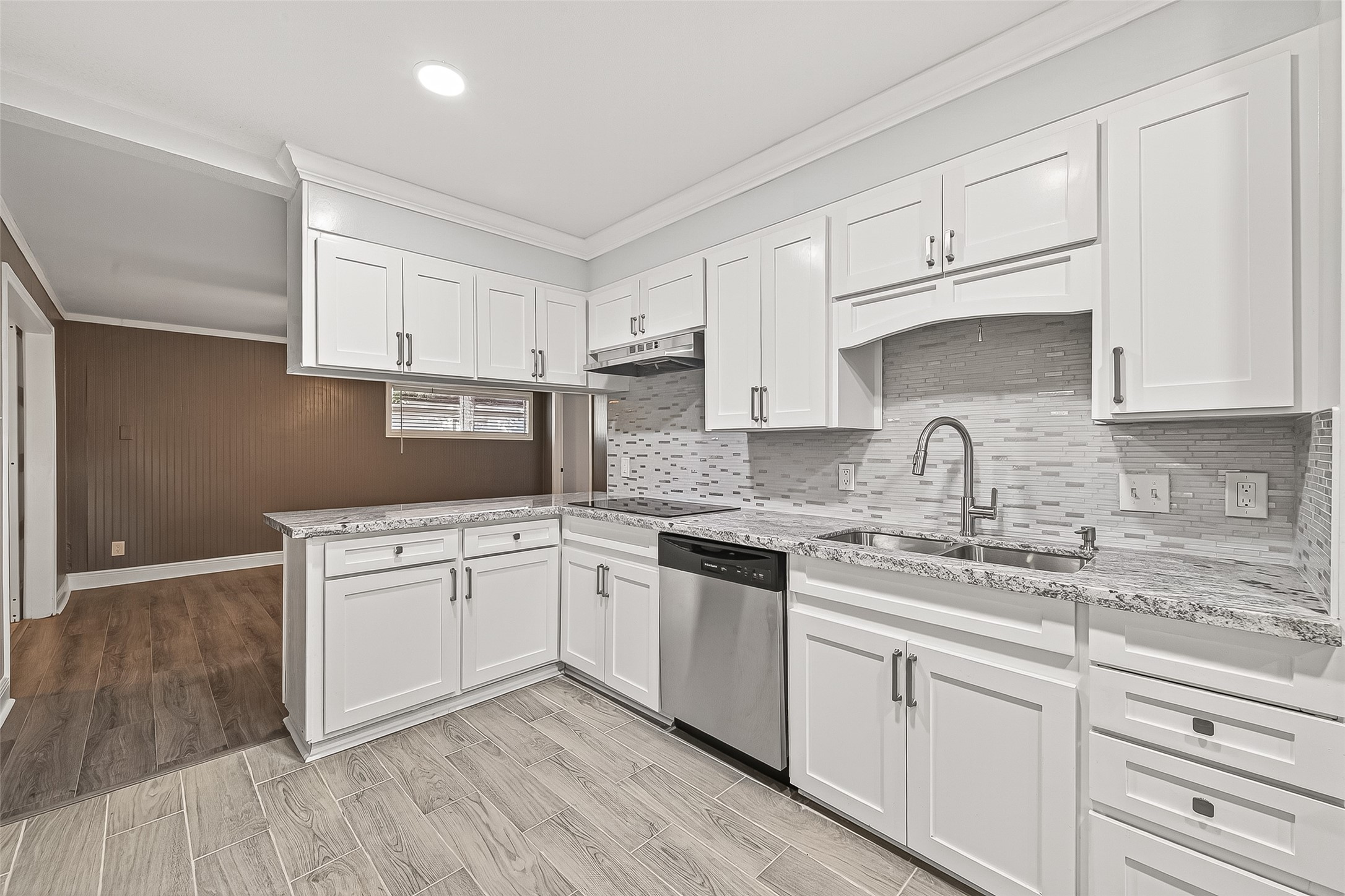 4729 Paradise Lane Houston, TX 77048 - Photo 35 of 43 a kitchen with granite countertop white cabinets and white appliances
