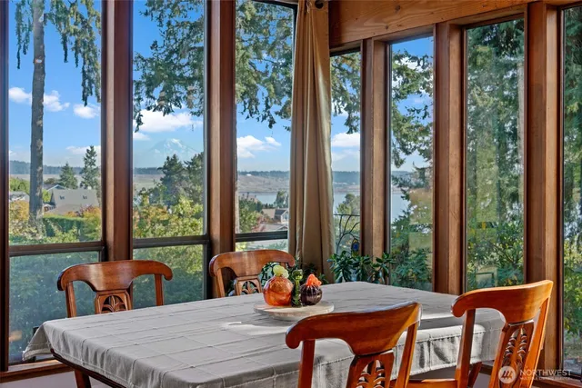 a view of a dining room with furniture window and outside view