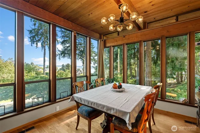 a living room with furniture a fireplace and a table