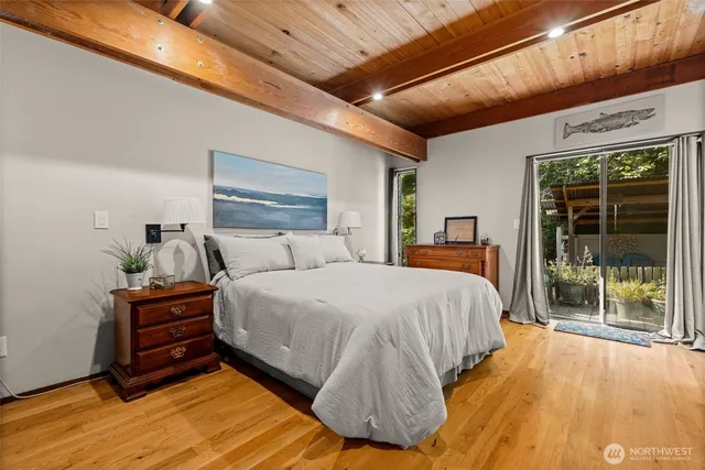 a bedroom with a bed and window