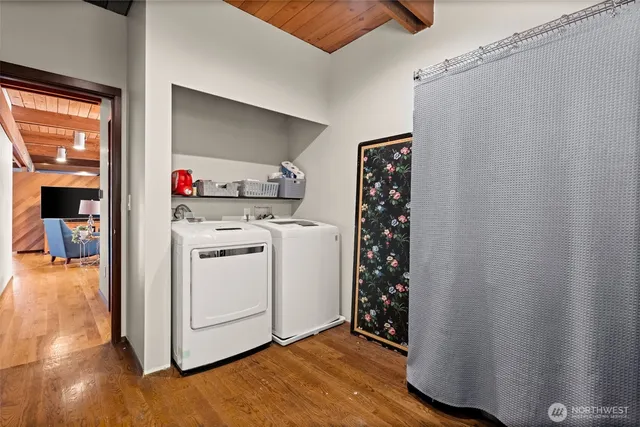 a view of empty room with wooden walls