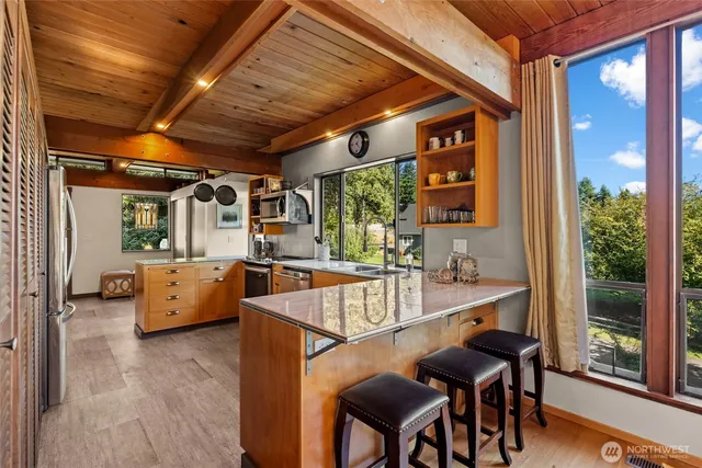 a view of a dining room with furniture window and outside view
