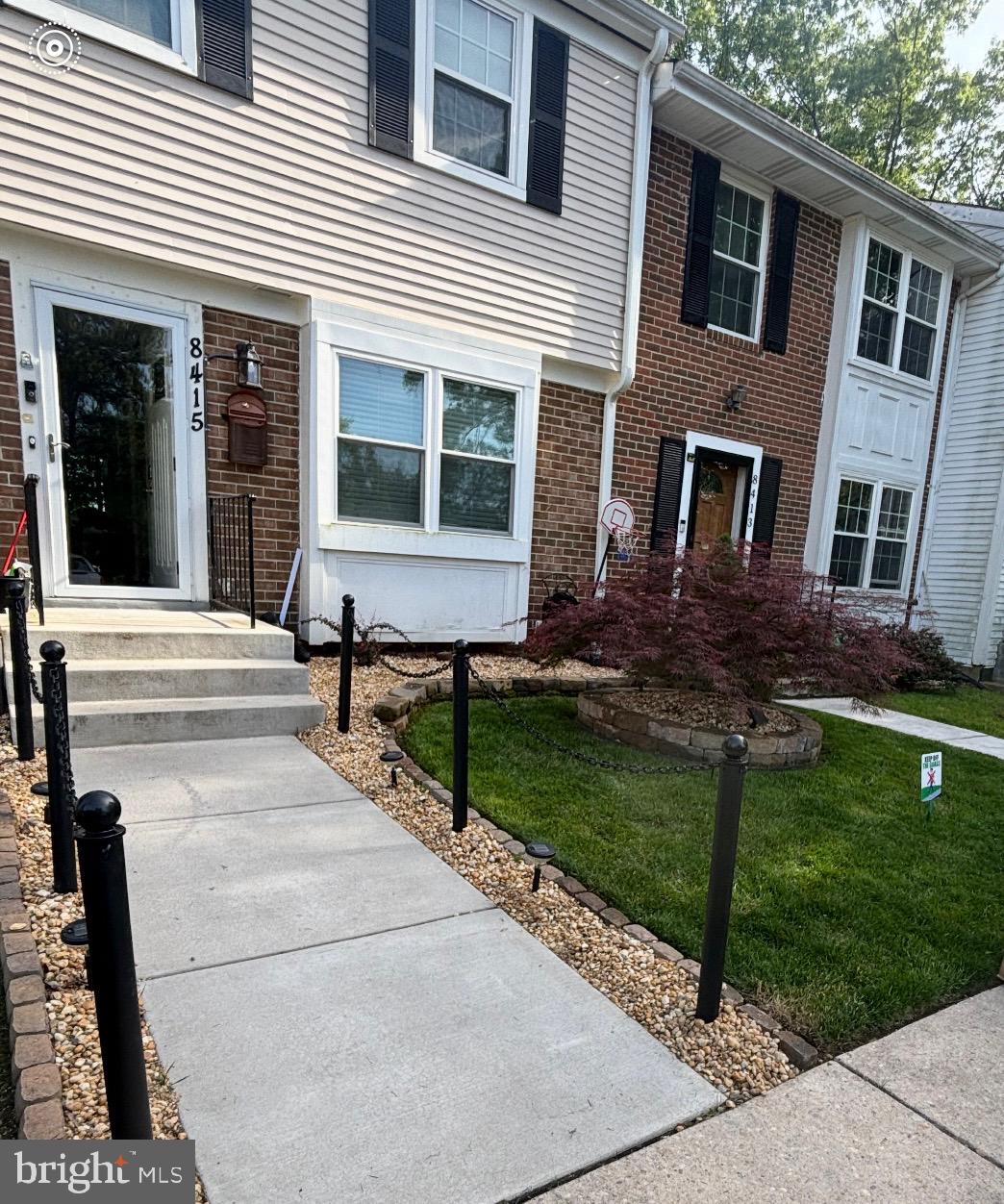 8415 Snowden Oaks Place Laurel, MD 20708 - Photo 1 of 4 Exterior front with manicured lawn