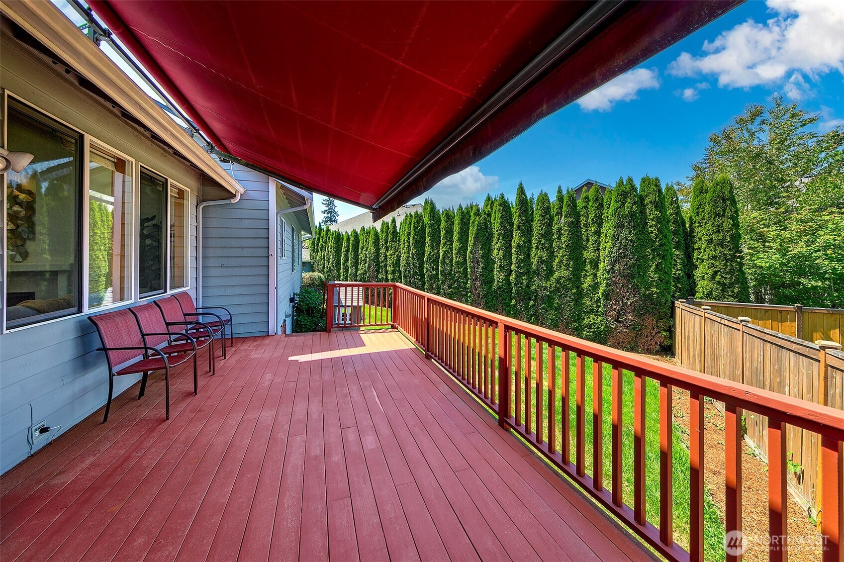 20604 Damson Road Lynnwood, WA 98036 - Photo 20 of 24 a balcony with wooden floor and outdoor seating