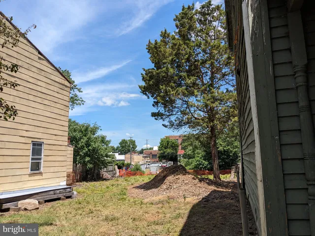 a view of a backyard with sitting area