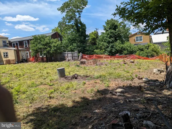 a backyard of a house with large trees