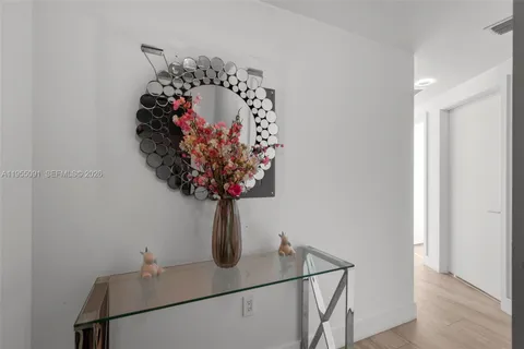 a view of a hallway with a flower pot