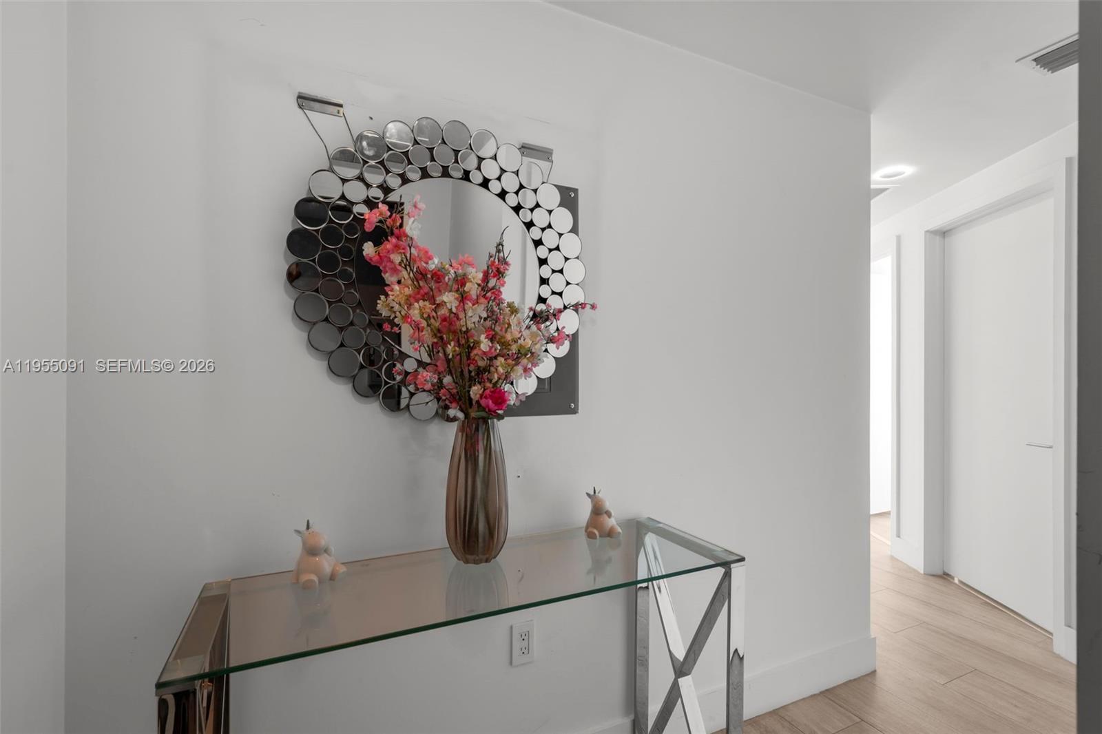 121 Northeast 34th Street, Unit 3001 Miami, FL 33137 - Photo 10 of 13 a view of a hallway with a flower pot