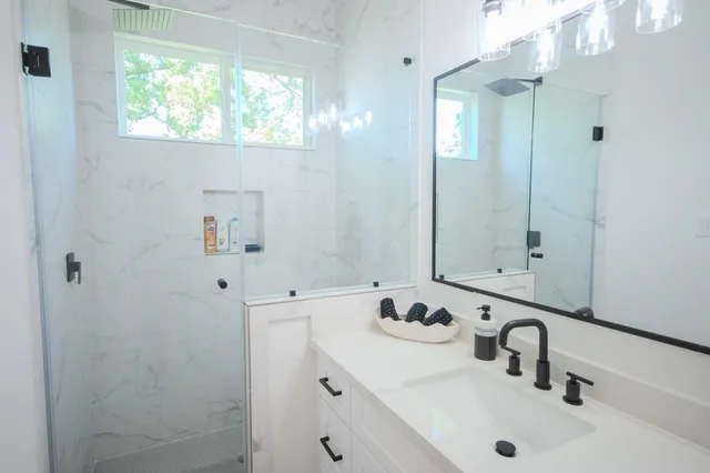 a bathroom with a sink and a mirror