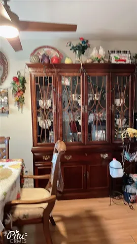 a bedroom with two beds and a chair