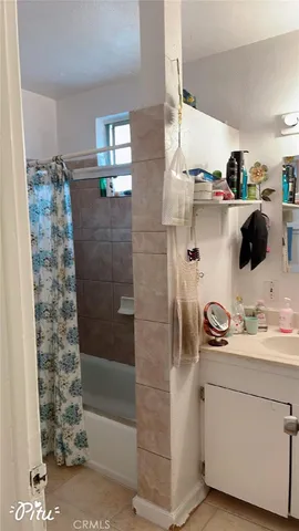 an aerial view of a house with garden space and street view