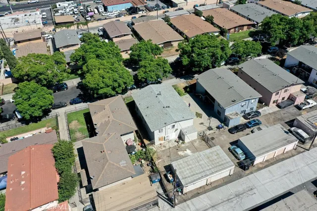 an aerial view of a houses with yard
