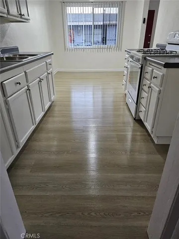 a kitchen with a sink and cabinets