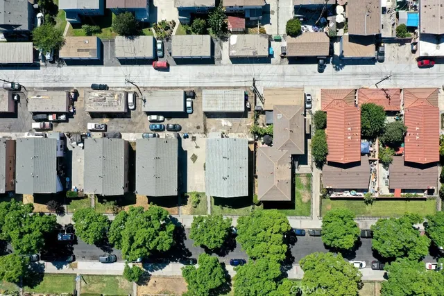 an aerial view of multiple houses with outdoor space