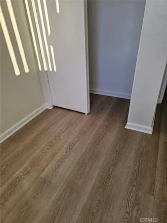 a bathroom with a toilet and a mirror