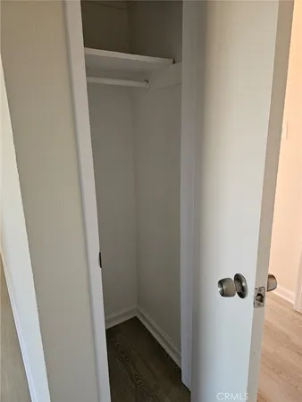 a bathroom with a toilet and a mirror