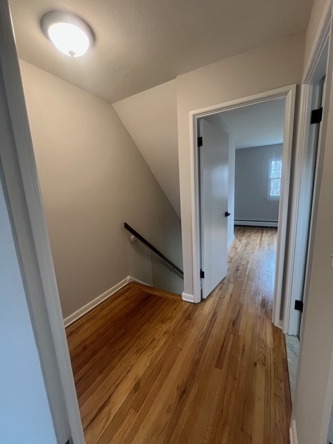 79 Beths Avenue, Unit 100 Bristol, CT 06010 - Photo 14 of 29 a view of hallway with wooden floor