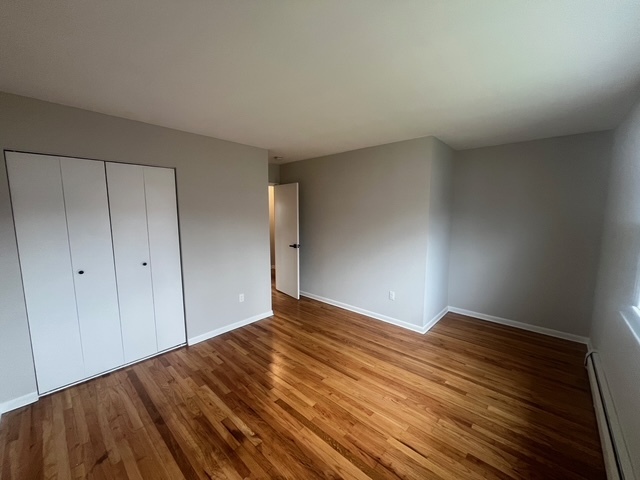 79 Beths Avenue, Unit 100 Bristol, CT 06010 - Photo 18 of 29 a view of empty room with wooden floor