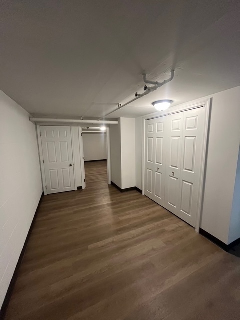 79 Beths Avenue, Unit 100 Bristol, CT 06010 - Photo 23 of 29 a view of empty room with wooden floor