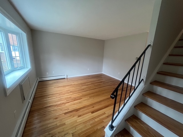 79 Beths Avenue, Unit 100 Bristol, CT 06010 - Photo 10 of 29 wooden floor in an empty room with a window