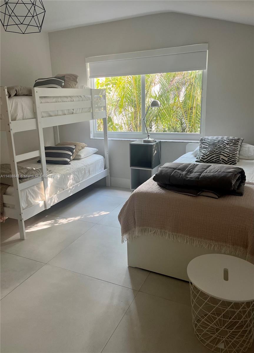 337 Southwest 23rd Road, Unit 1 Miami, FL 33129 - Photo 19 of 31 a bedroom with a bed and a window