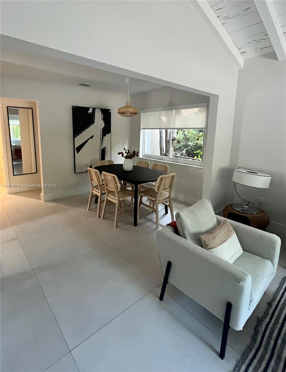 337 Southwest 23rd Road, Unit 1 Miami, FL 33129 - Photo 26 of 31 a living room with furniture and a window