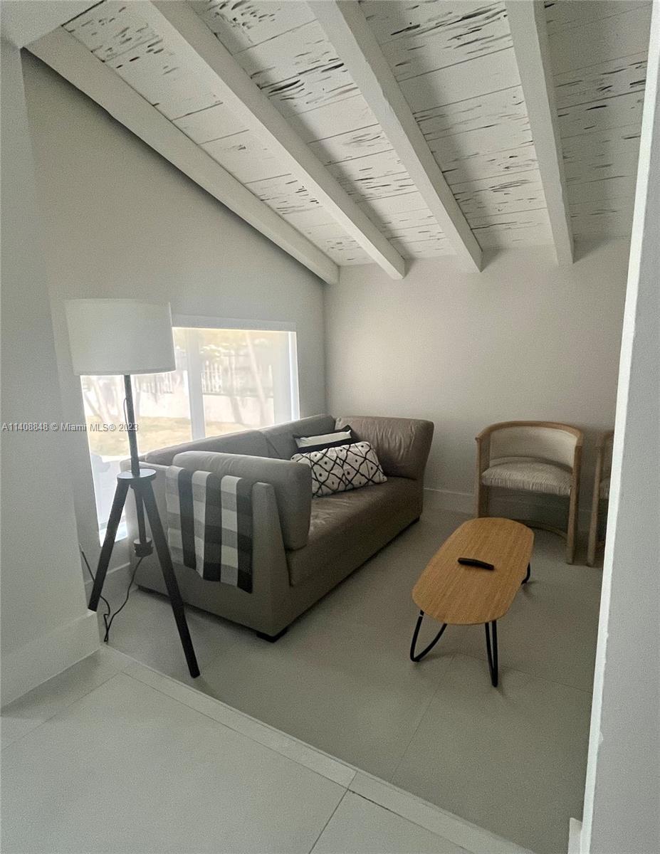 337 Southwest 23rd Road, Unit 1 Miami, FL 33129 - Photo 4 of 31 a living room with furniture and a rug