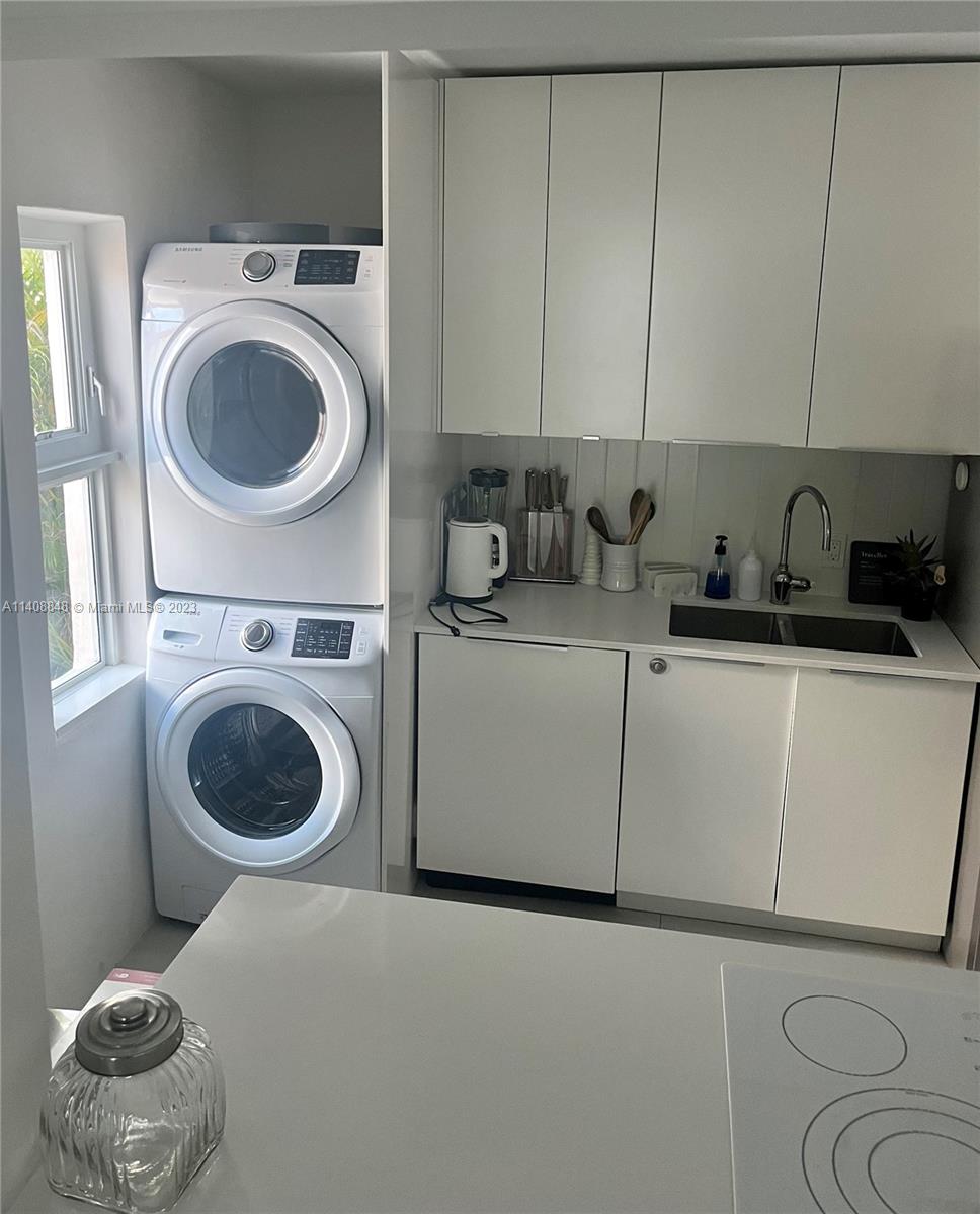 337 Southwest 23rd Road, Unit 1 Miami, FL 33129 - Photo 9 of 31 a utility room with sink dryer and washer