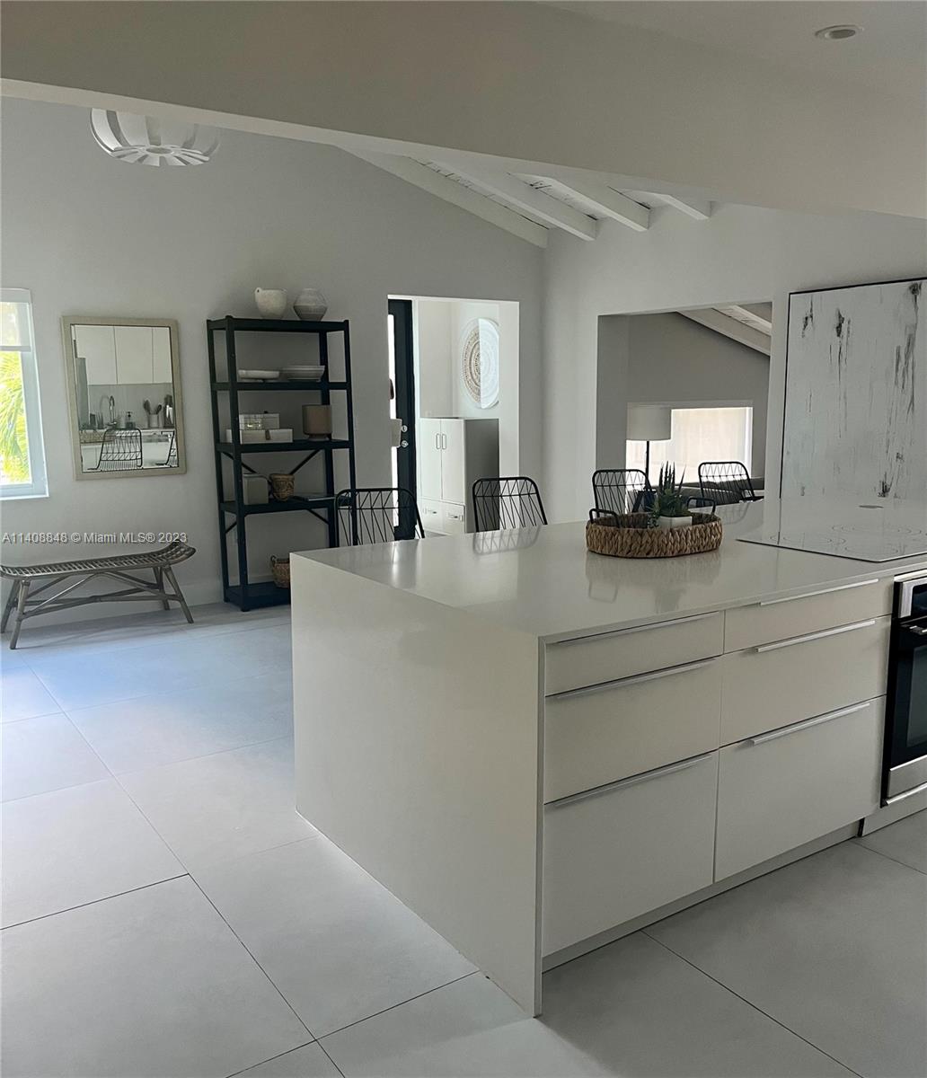 337 Southwest 23rd Road, Unit 1 Miami, FL 33129 - Photo 10 of 31 a kitchen with cabinets and window