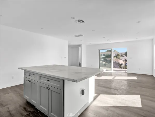 a view of a balcony with wooden floor and city view