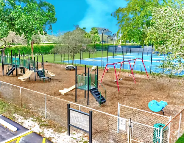 a view of a park with swings