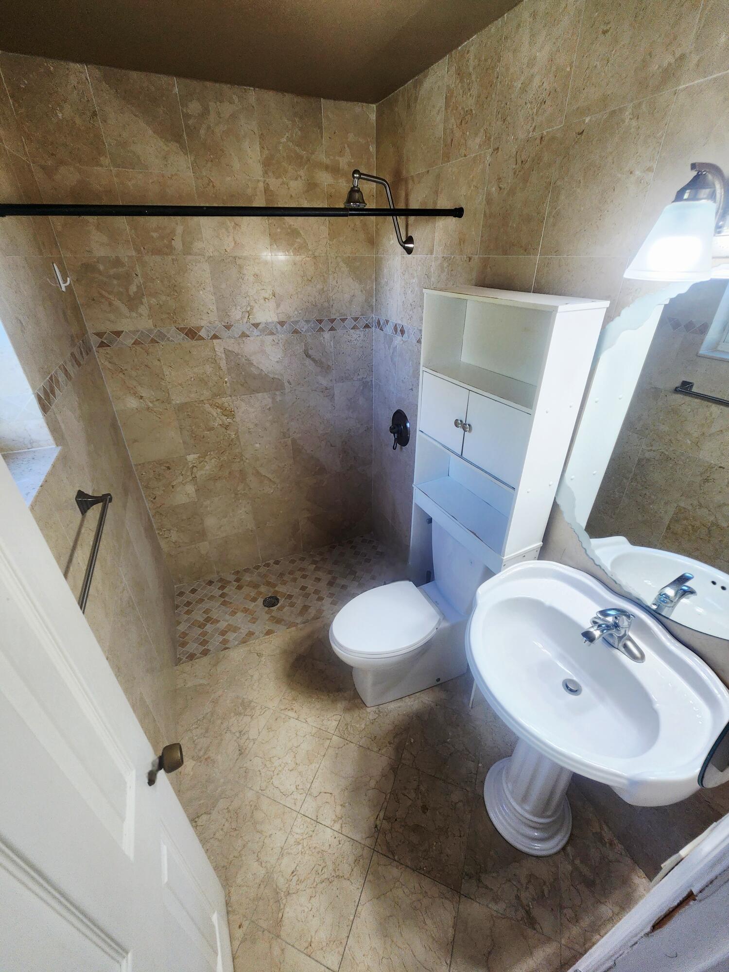 19323 Carolina Circle Boca Raton, FL 33434 - Photo 17 of 24 a bathroom with a sink toilet and shower