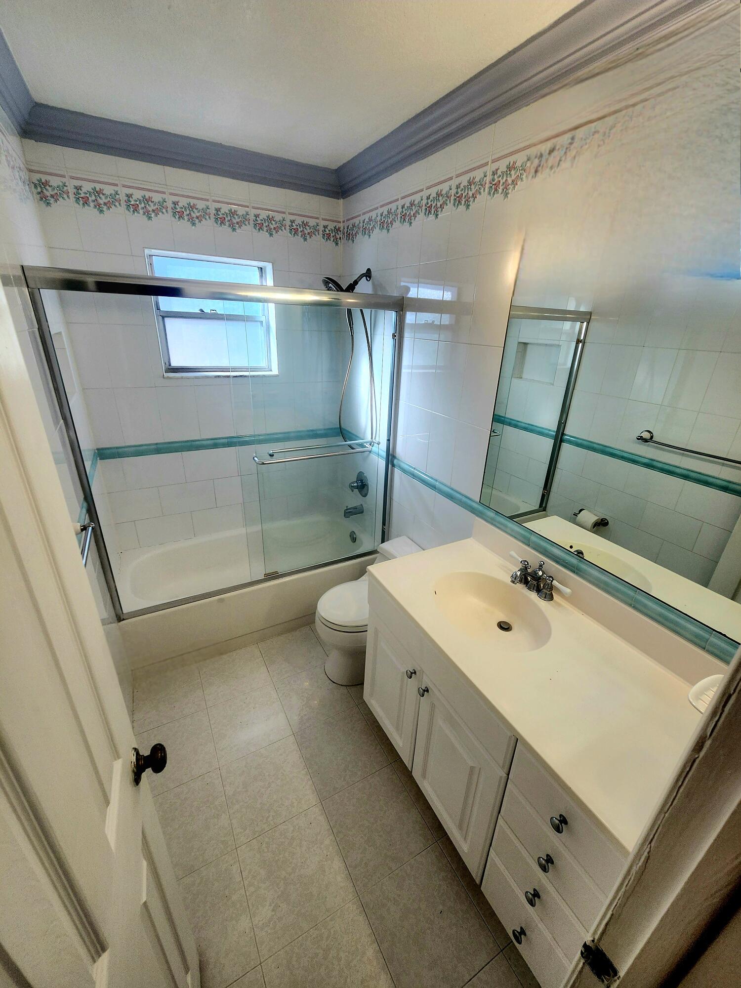 19323 Carolina Circle Boca Raton, FL 33434 - Photo 22 of 24 a bathroom with a tub sink toilet and shower