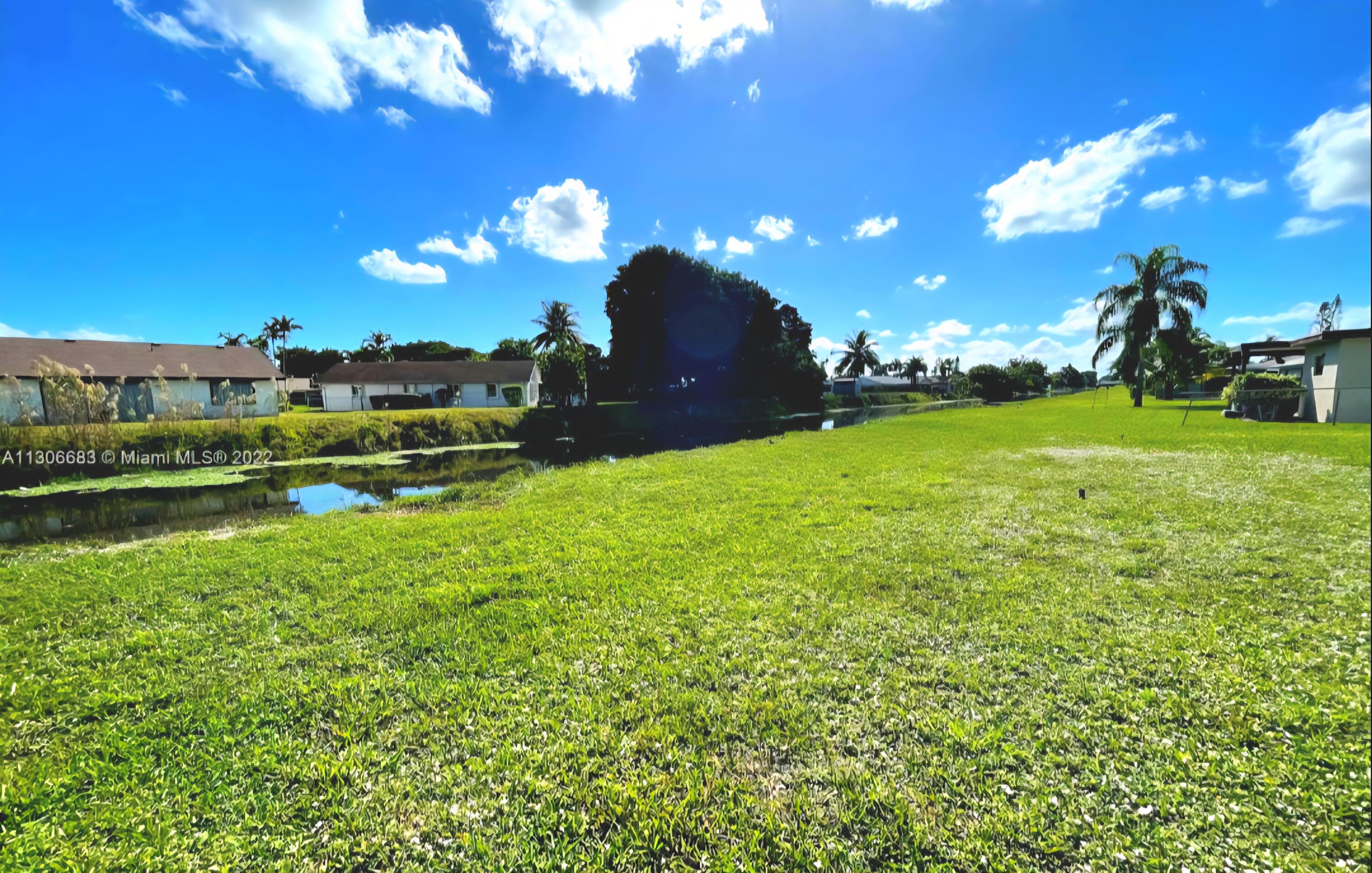 19323 Carolina Circle Boca Raton, FL 33434 - Photo 3 of 24 a view of a golf course with a lake view