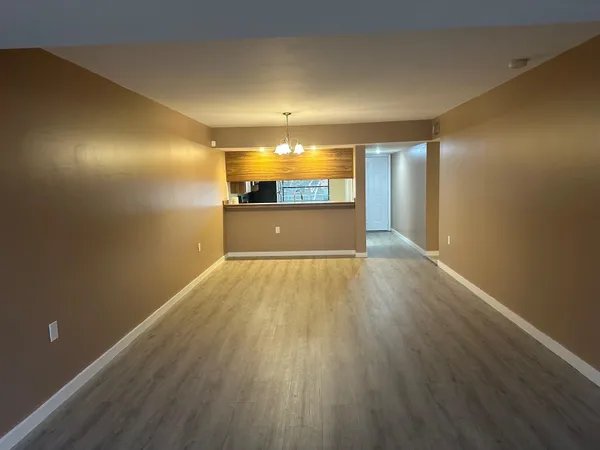 a view of room with wooden floor