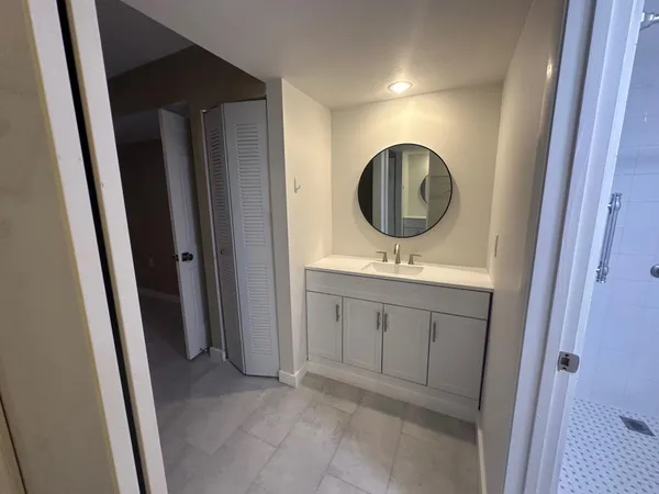 a bathroom with a sink and a mirror