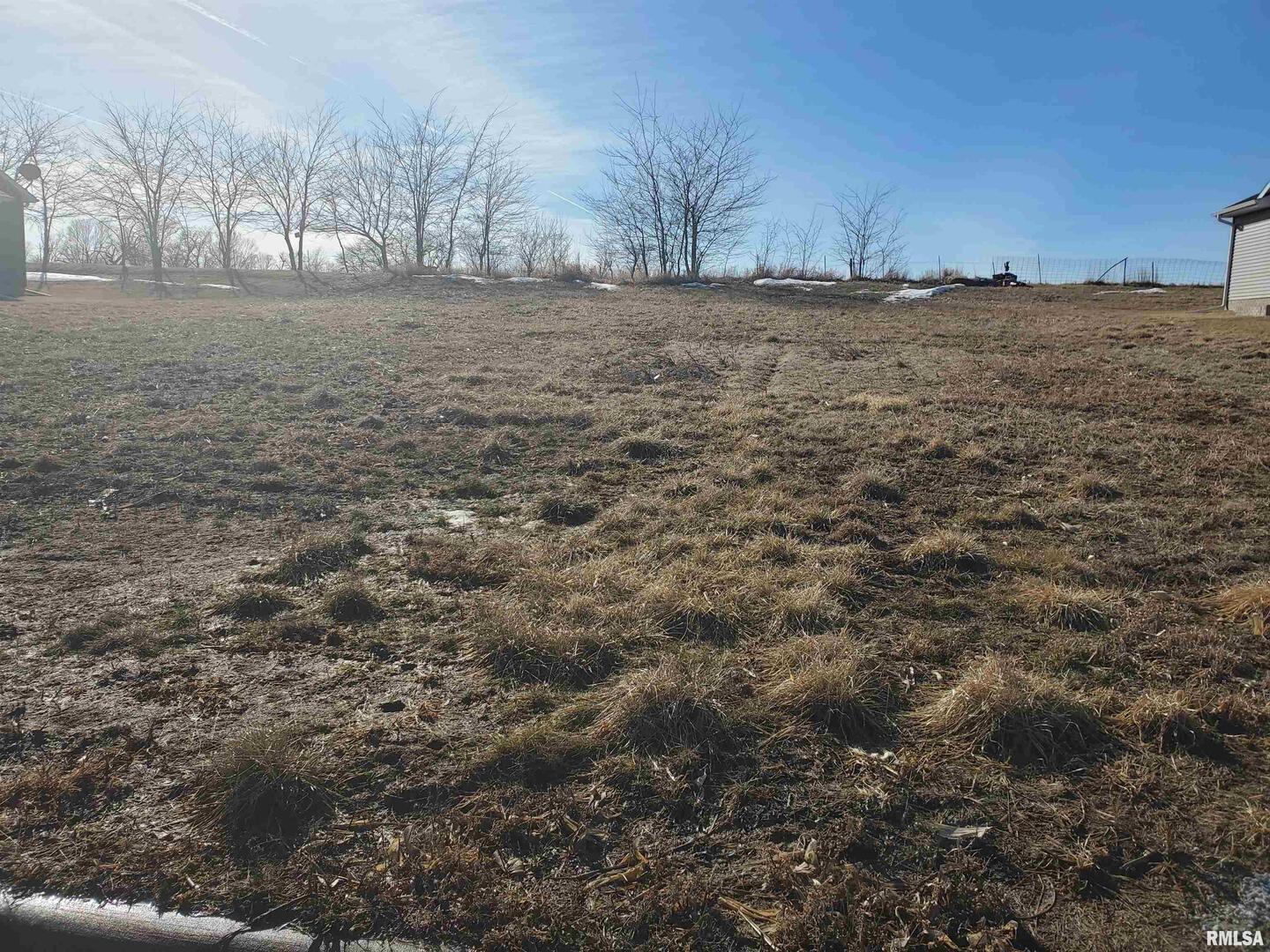 3500 Tower Court Clinton, IA 52732 - Photo 2 of 2 a view of dirt field and trees