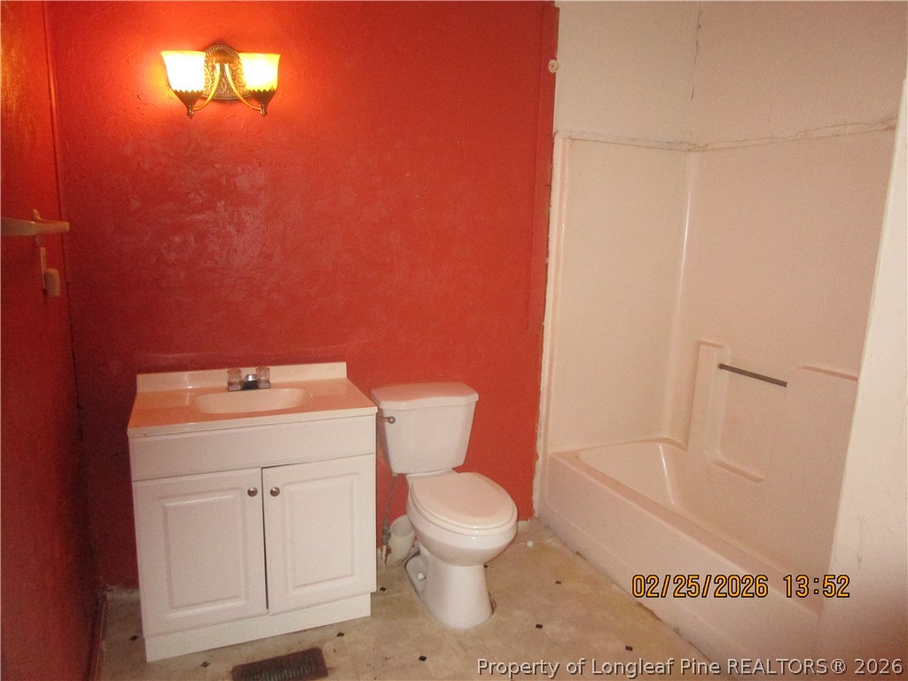 256 Chesters Road Roseboro, NC 28382 - Photo 13 of 22 a bathroom with a sink and a toilet