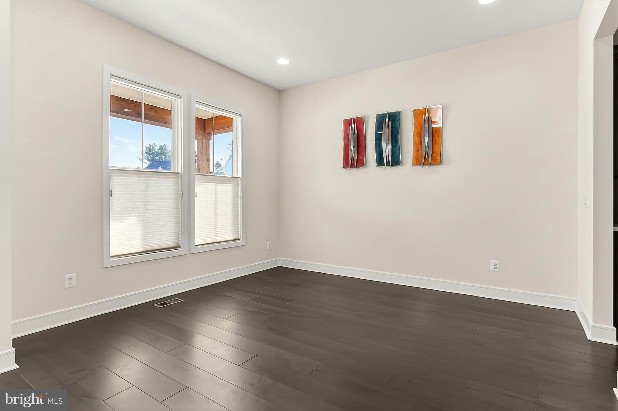 41424 Gentle Wind Place Aldie, VA 20105 - Photo 14 of 83 an empty room with wooden floor and windows