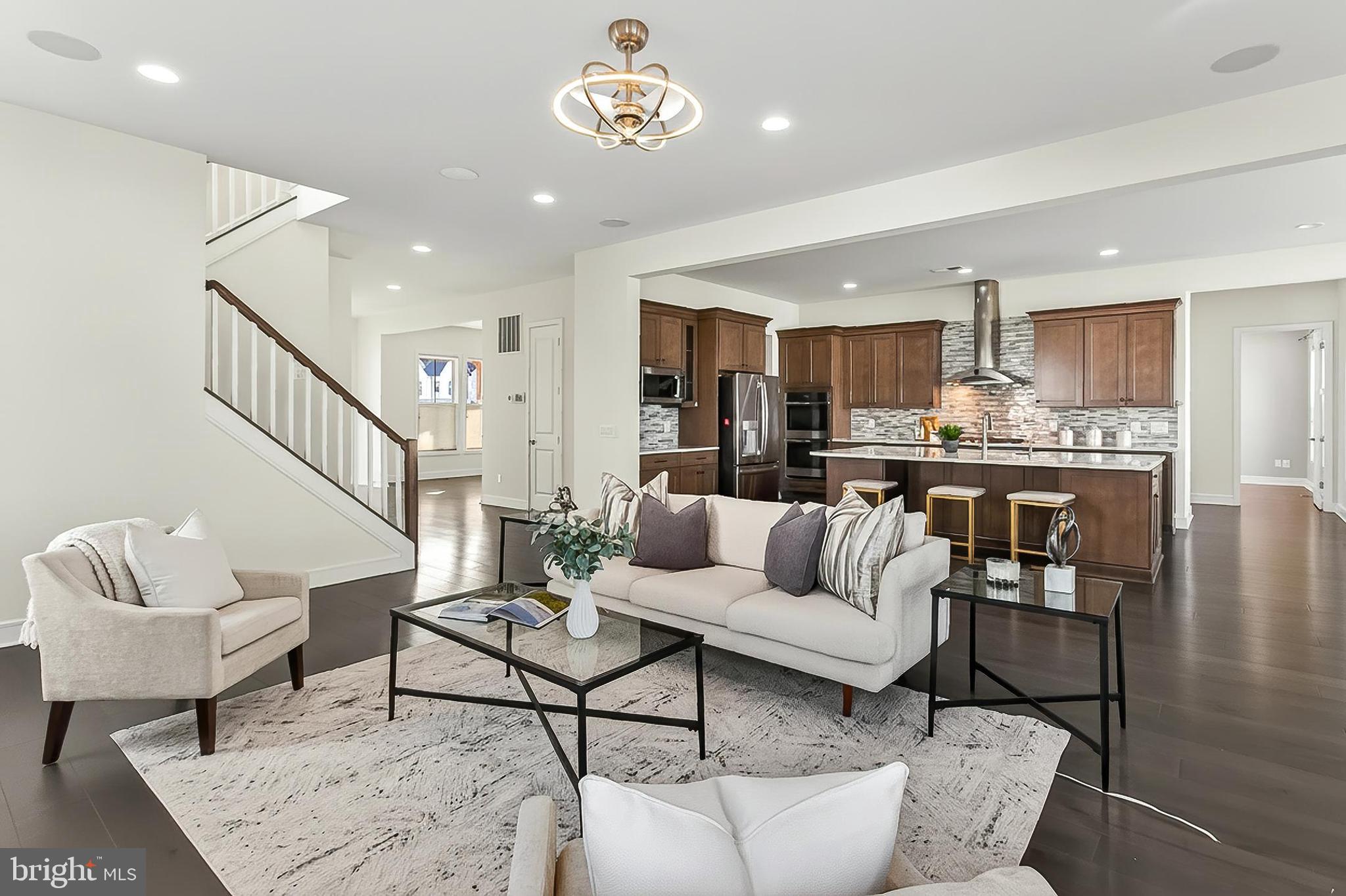 41424 Gentle Wind Place Aldie, VA 20105 - Photo 19 of 83 a living room with furniture and kitchen view